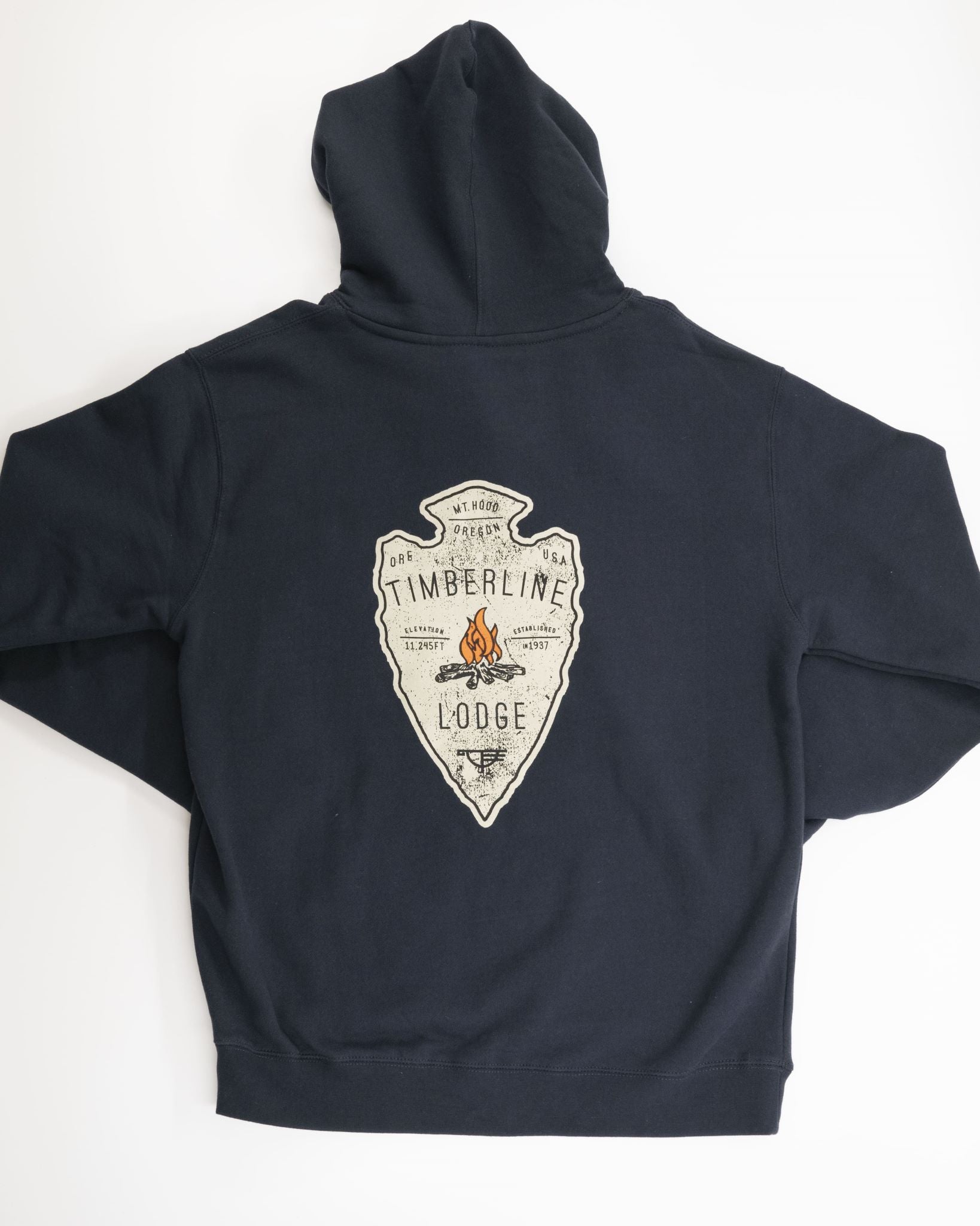 Navy Blue Sweatshirt with an arrowhead shaped logo. There is a fire in the middle of the arrowhead and Timberline Lodge is written above and below the camp fire.