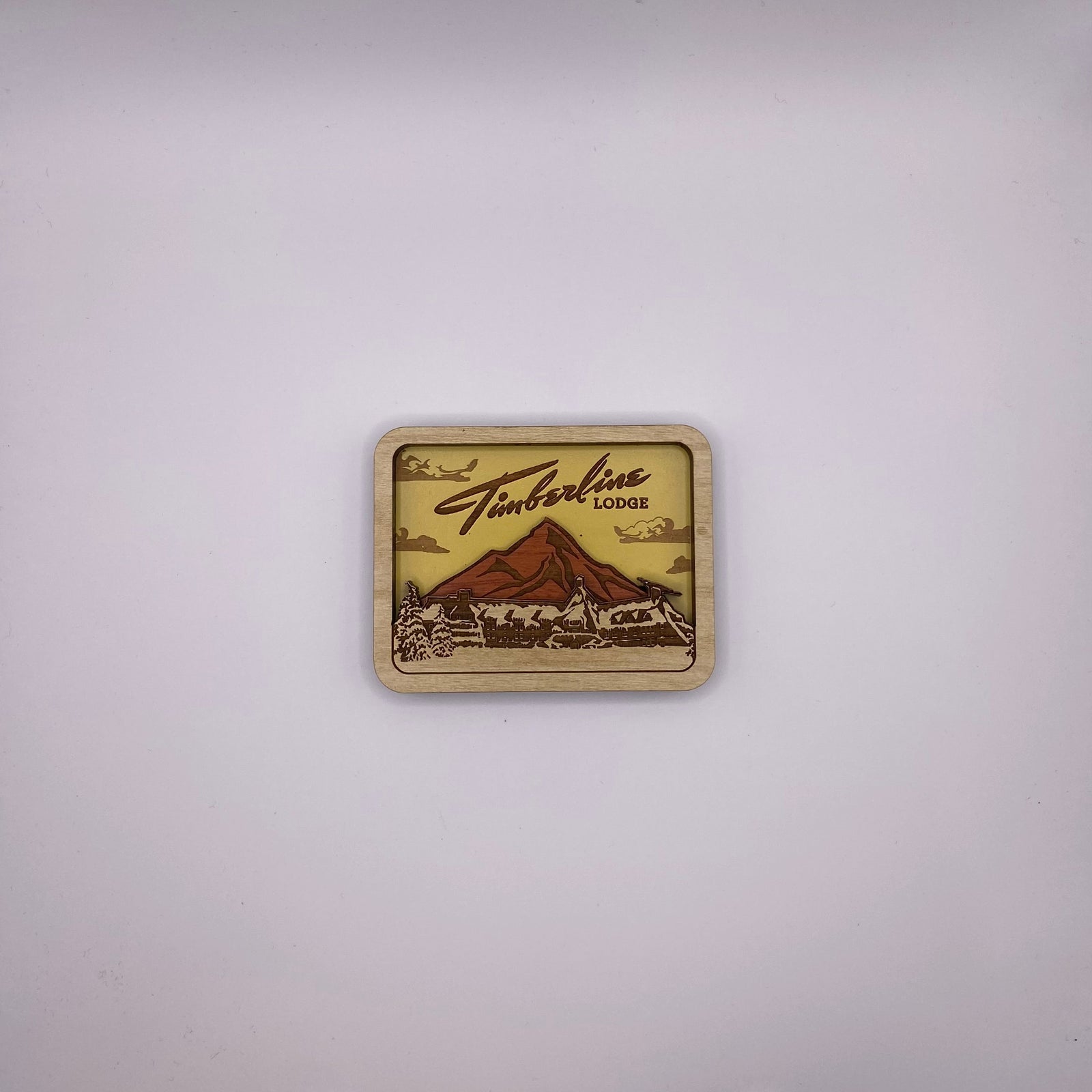 Wooden sign with 'Timberline Lodge' logo on a white background