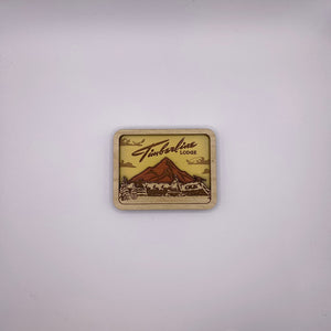 Wooden sign with 'Timberline Lodge' logo on a white background