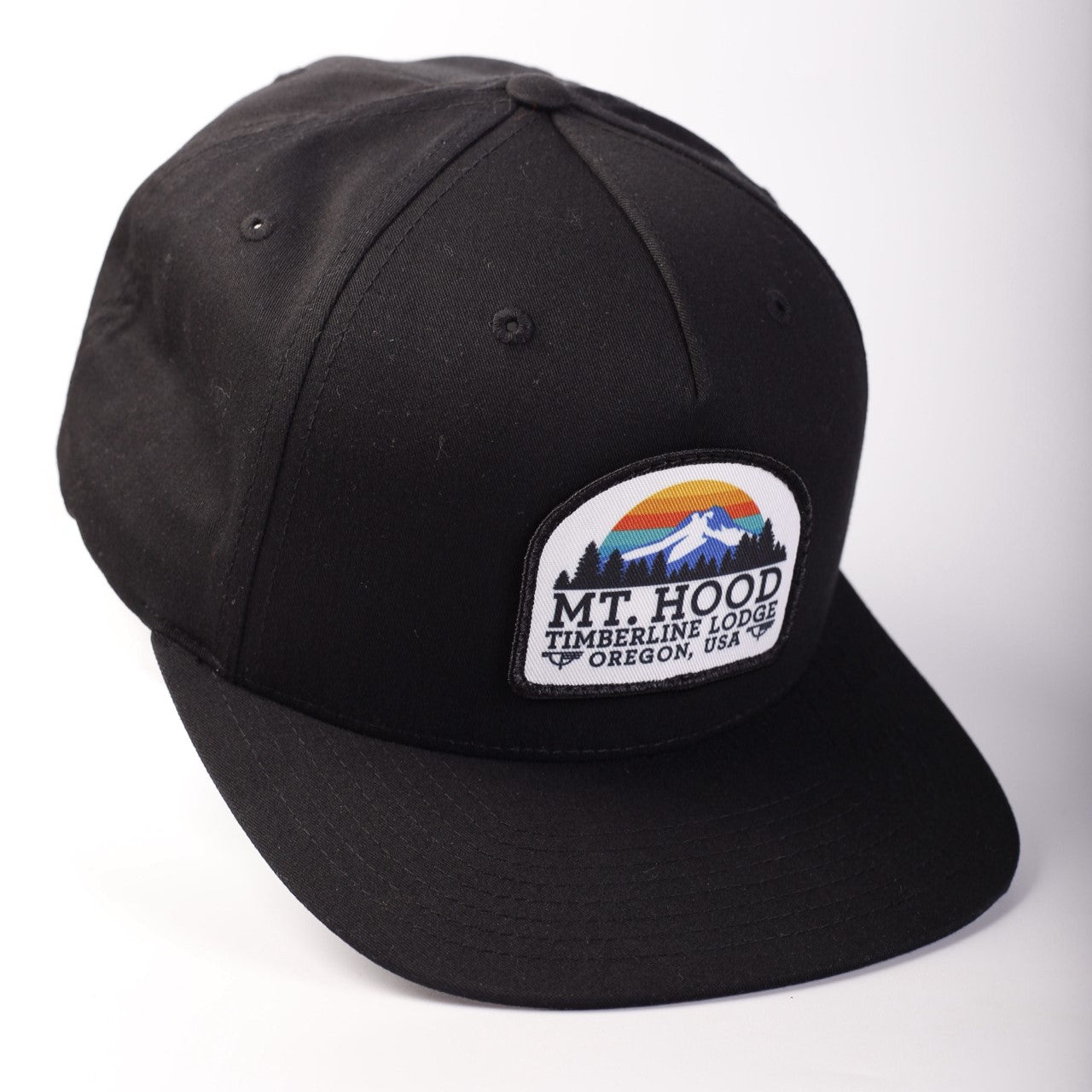 Black cap with a patch featuring 'Mt. Hood Timberline Lodge, Oregon, USA' on a white background