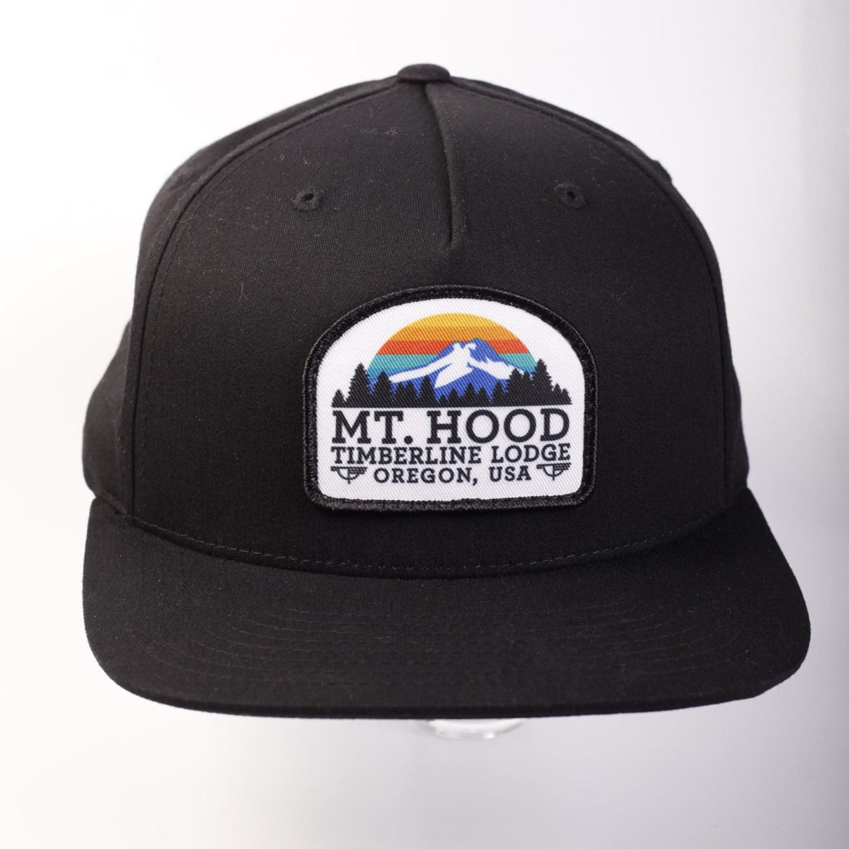 Black cap with a patch featuring 'Mt. Hood Timberline Lodge, Oregon, USA' on a white background
