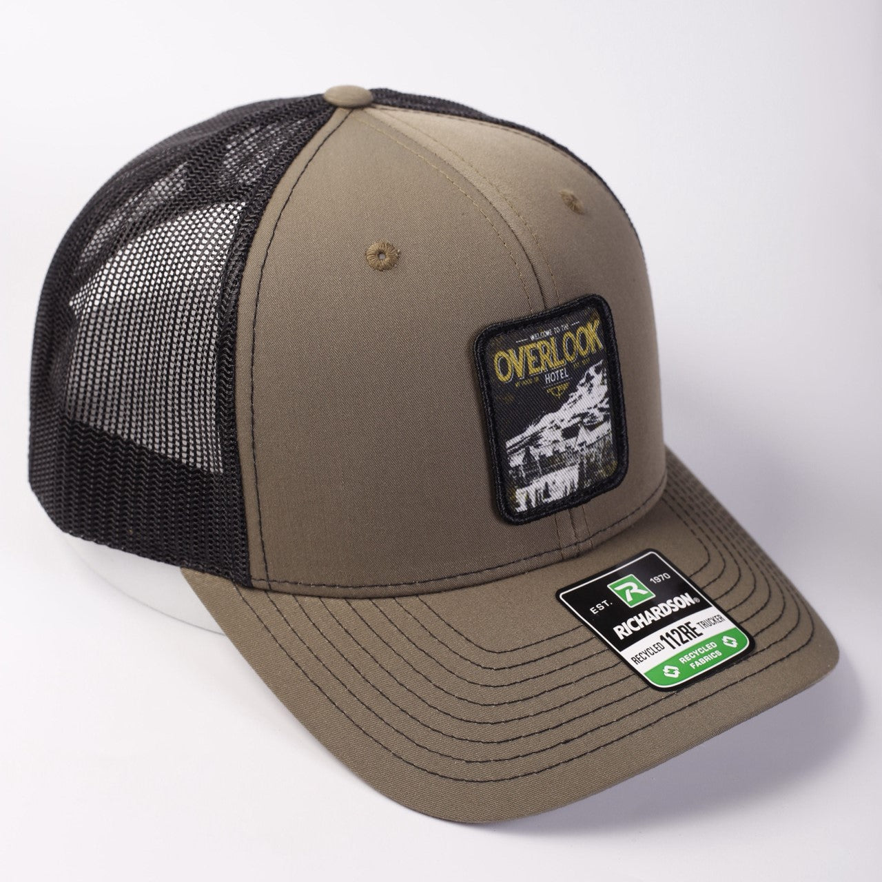 Brown and black trucker cap with a patch on a white background