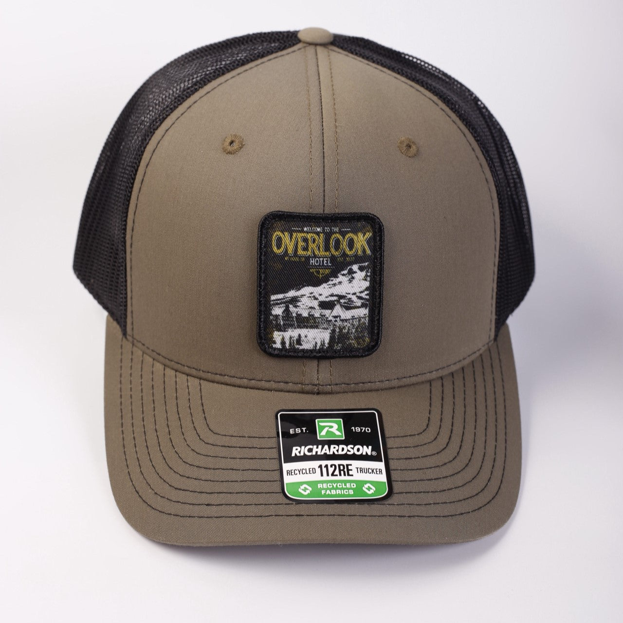 Brown cap with black mesh back and 'Overlook' patch on a white background